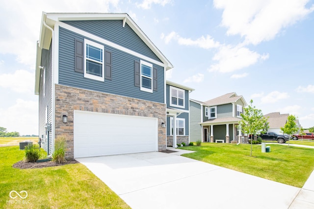 view of front of house featuring a garage and a front yard