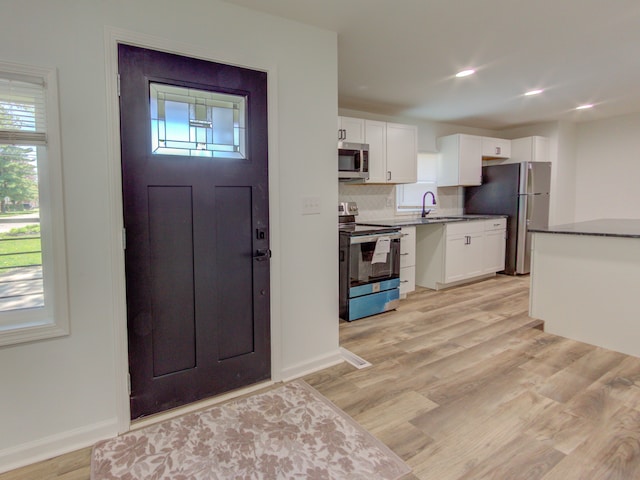 entrance foyer featuring light wood-type flooring