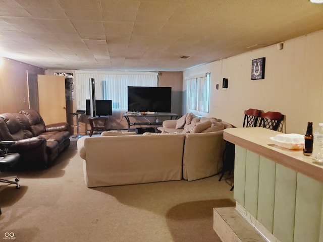 living room featuring light carpet and plenty of natural light