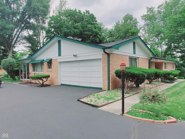 ranch-style house featuring a garage