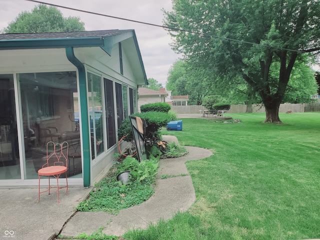 view of yard featuring a sunroom