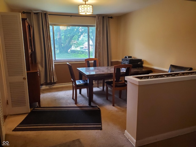 view of carpeted dining area