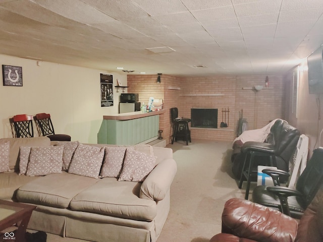 carpeted living room featuring a brick fireplace