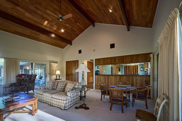 carpeted living room with wood ceiling, beamed ceiling, ceiling fan, and high vaulted ceiling