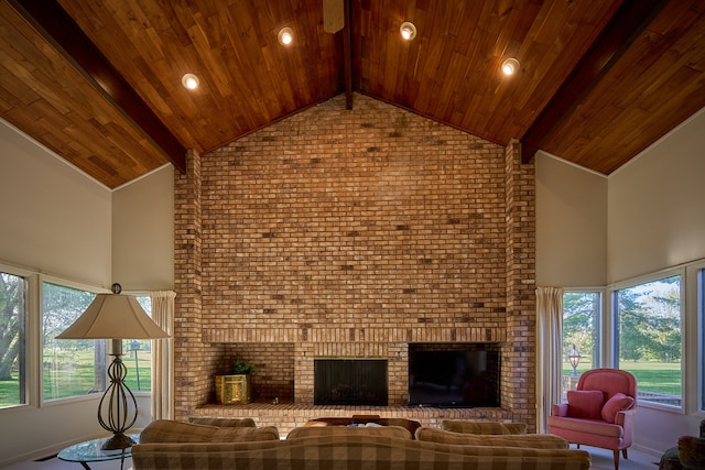 living room featuring wood ceiling, high vaulted ceiling, brick wall, and a brick fireplace