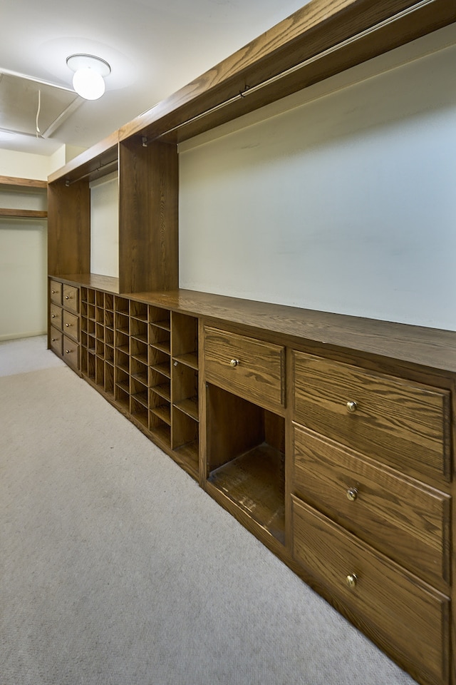 walk in closet featuring dark colored carpet