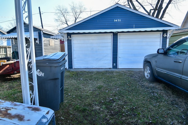 garage featuring a yard