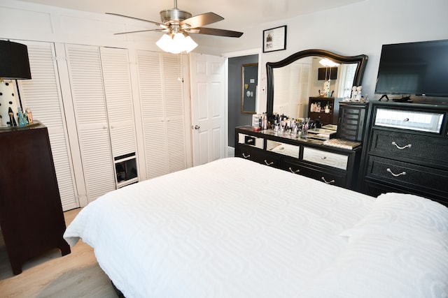 bedroom with ceiling fan and light wood-type flooring