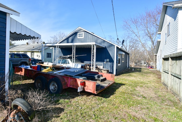 view of side of property with a yard