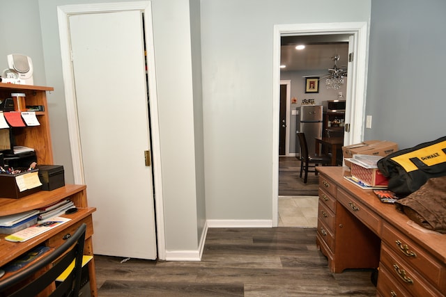 office featuring ceiling fan and dark tile flooring