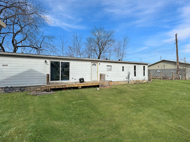 back of house with a yard