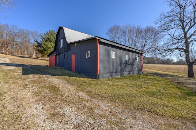 view of shed / structure with a lawn