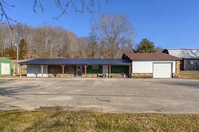 ranch-style house featuring a garage