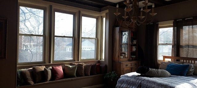 bedroom featuring an inviting chandelier