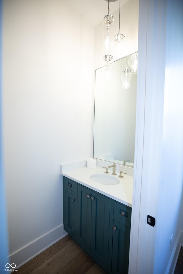 bathroom featuring vanity and hardwood / wood-style floors