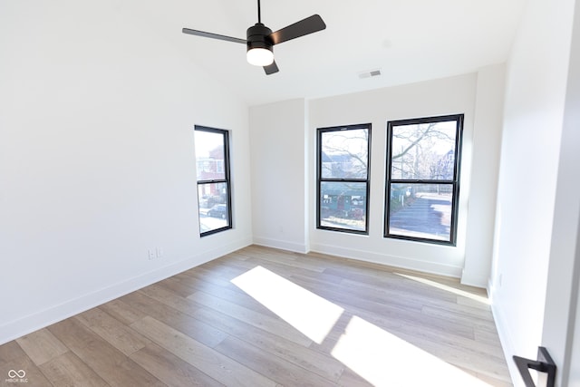 2133 N Talbott St, Indianapolis, IN 46202 - unfurnished room featuring healthy amount of natural light, light wood-type flooring, vaulted ceiling, and ceiling fan