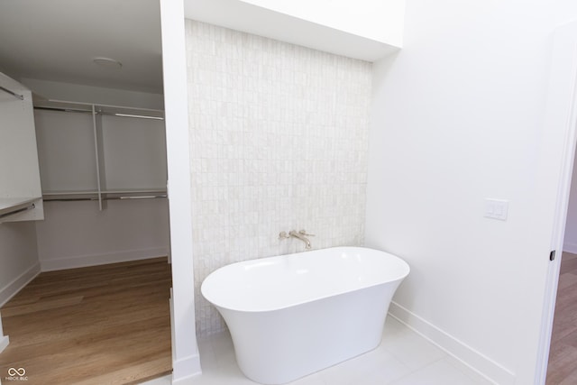 2133 N Talbott St, Indianapolis, IN 46202 - full bathroom featuring a soaking tub and wood finished floors