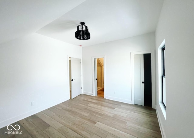 unfurnished bedroom featuring light wood-type flooring