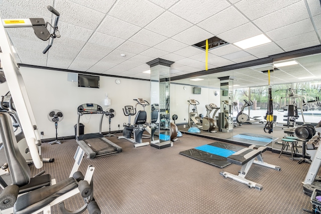 gym with a drop ceiling and carpet floors