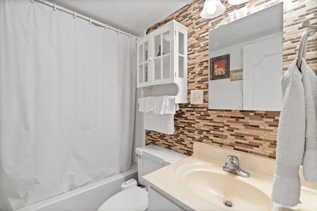 full bathroom featuring shower / bath combo with shower curtain, toilet, tasteful backsplash, and vanity