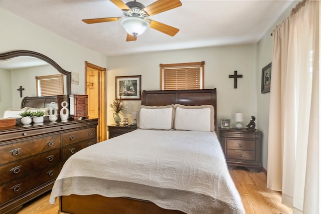 bedroom featuring light hardwood / wood-style flooring and ceiling fan