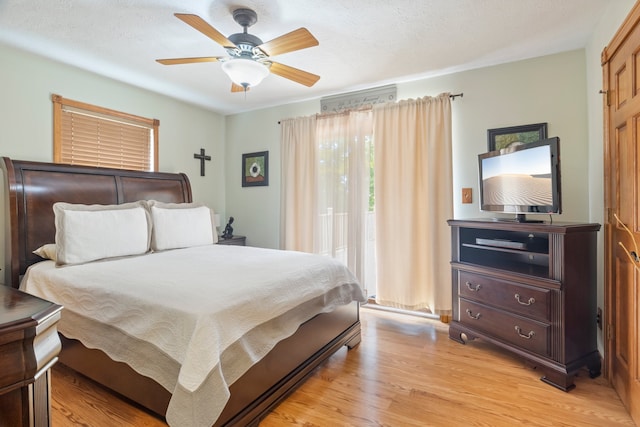 bedroom featuring light hardwood / wood-style floors and ceiling fan