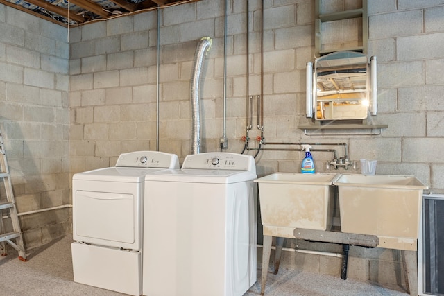 clothes washing area featuring independent washer and dryer and hookup for a washing machine