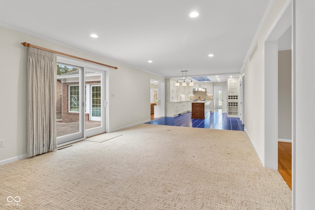 unfurnished living room with dark carpet and crown molding