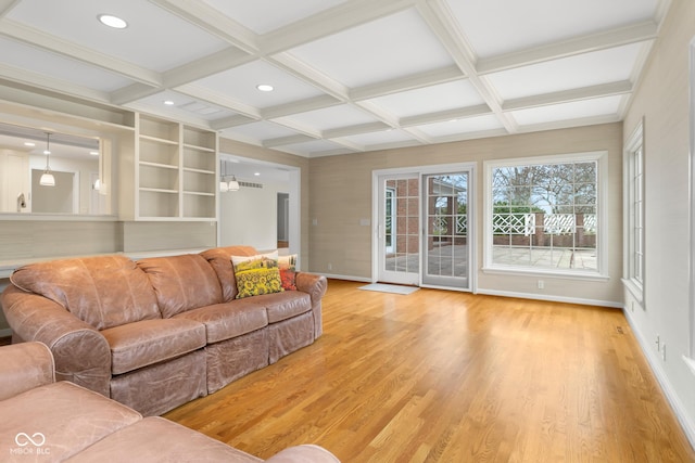 living room with beamed ceiling, coffered ceiling, and hardwood / wood-style floors