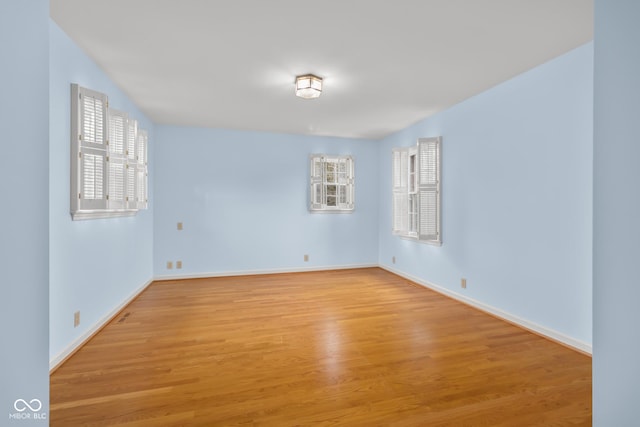 unfurnished room with light hardwood / wood-style floors