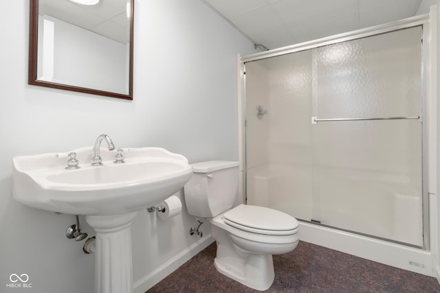 bathroom featuring an enclosed shower and toilet