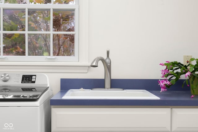 interior details with washer / clothes dryer and sink