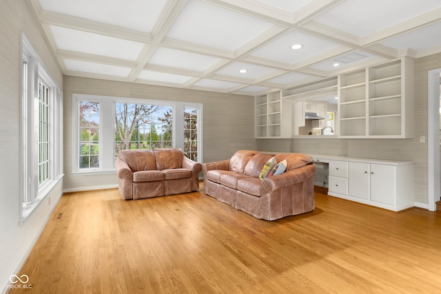 living room featuring beamed ceiling, coffered ceiling, and light hardwood / wood-style floors