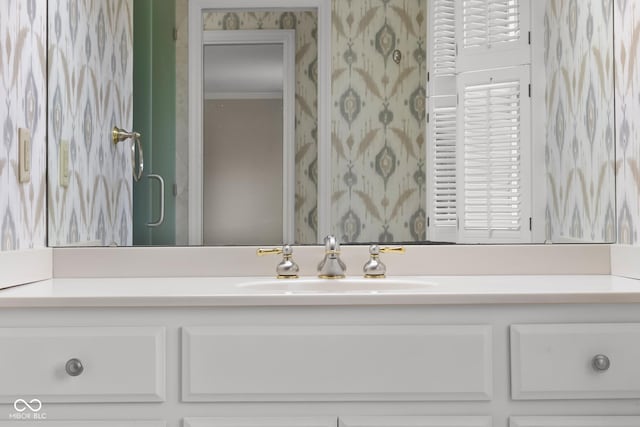 bathroom featuring vanity and crown molding