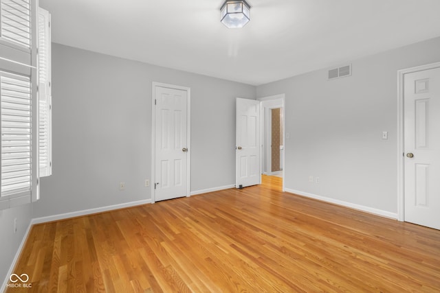 unfurnished bedroom with light hardwood / wood-style flooring