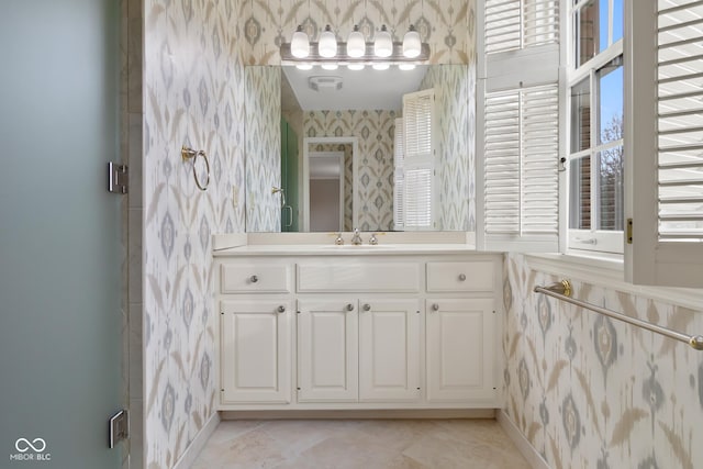 bathroom with tile patterned flooring and vanity