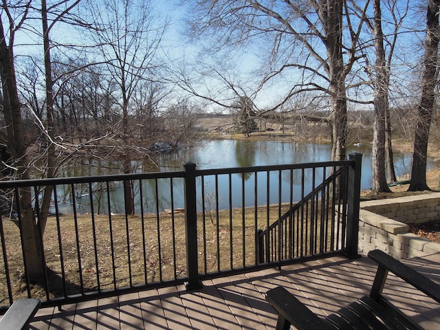 wooden deck featuring a water view