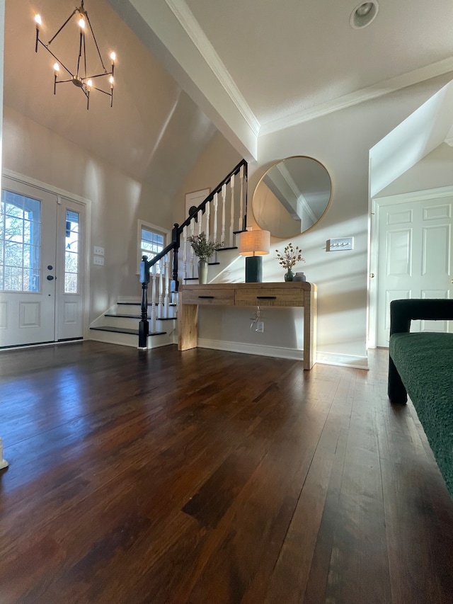 entryway featuring dark hardwood / wood-style floors, a notable chandelier, and vaulted ceiling with beams