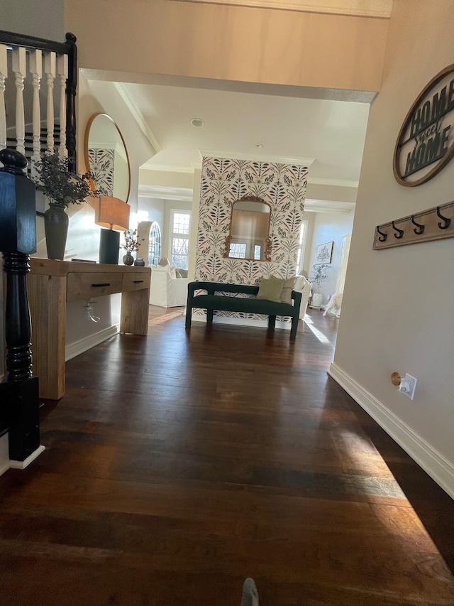 hallway with ornamental molding and hardwood / wood-style flooring