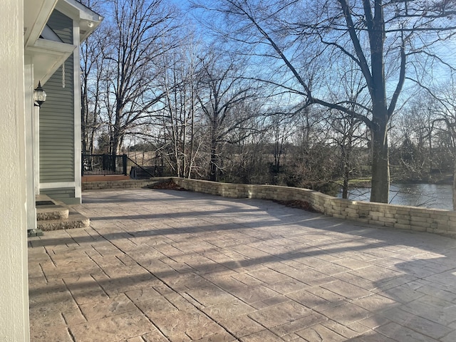 view of patio / terrace featuring a water view