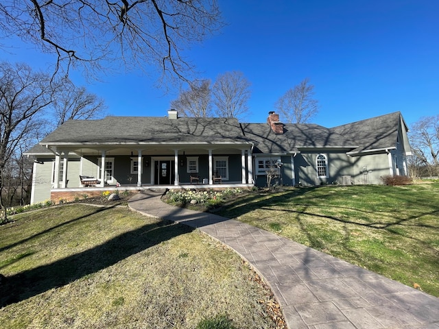 ranch-style home featuring a front yard and a porch