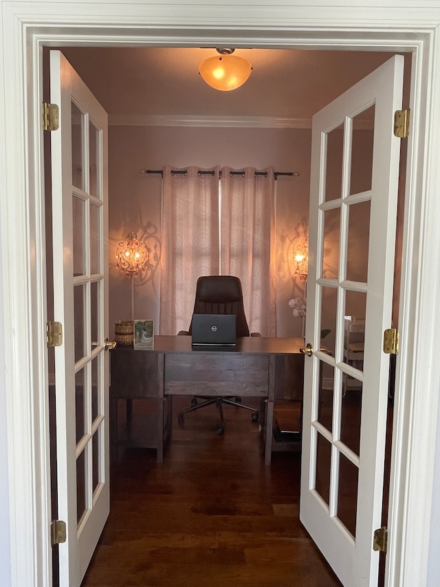 home office featuring french doors, crown molding, and dark hardwood / wood-style flooring