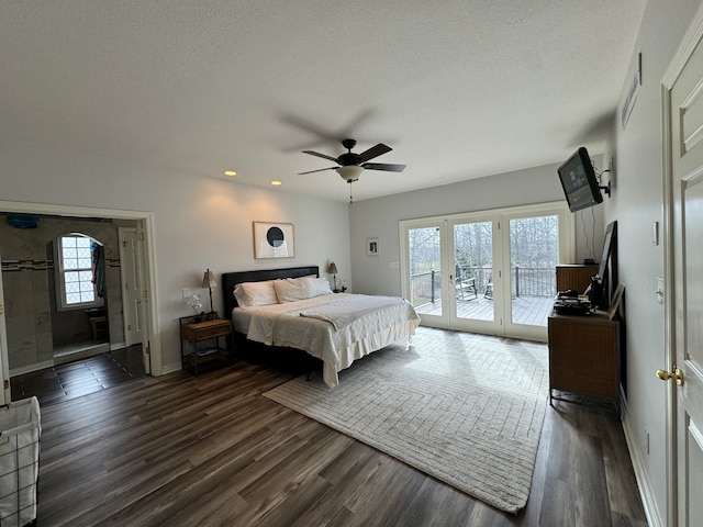 bedroom featuring french doors, ceiling fan, access to exterior, a textured ceiling, and dark hardwood / wood-style flooring