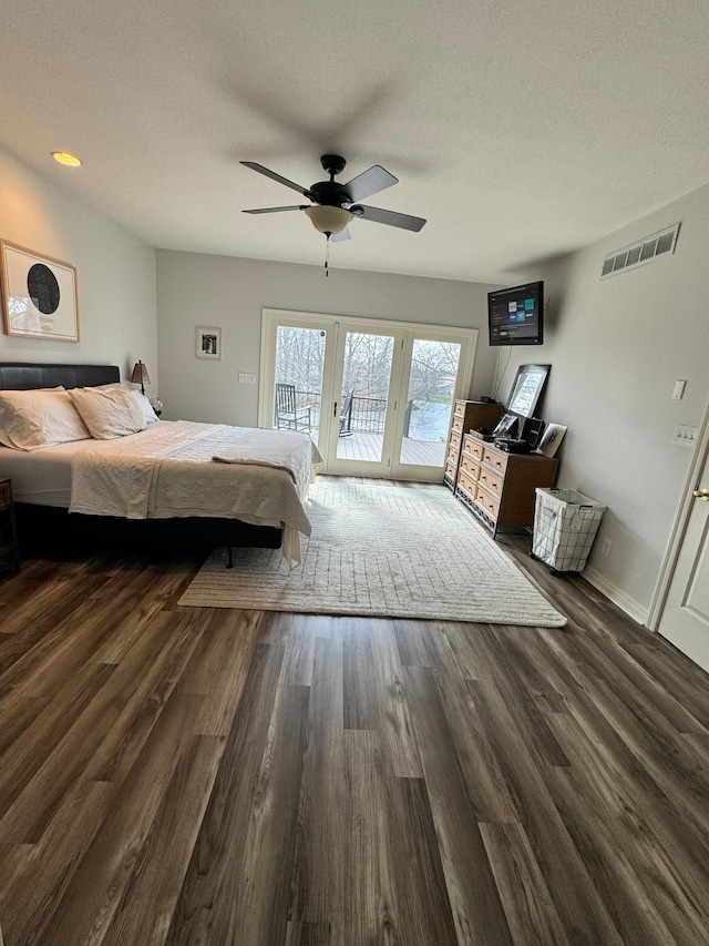 unfurnished bedroom featuring dark hardwood / wood-style flooring, ceiling fan, french doors, and access to exterior