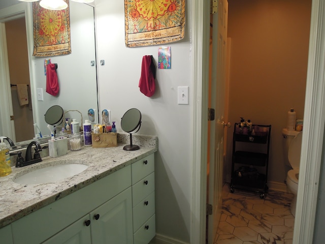 bathroom with vanity with extensive cabinet space, toilet, and tile flooring