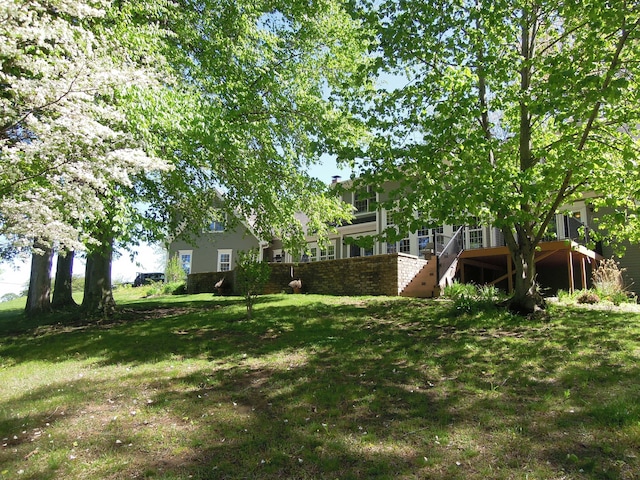 view of yard with a wooden deck