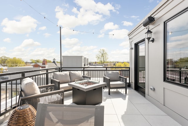 exterior space featuring an outdoor living space with a fire pit