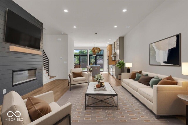 living room featuring a fireplace and hardwood / wood-style floors