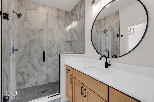 bathroom with a shower with door and vanity