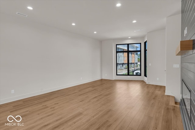 unfurnished living room with light wood-type flooring